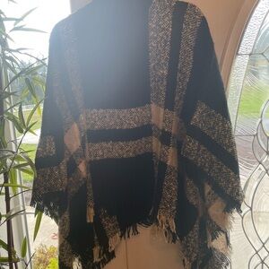 Soft black/white patterned poncho. One size fits most.
